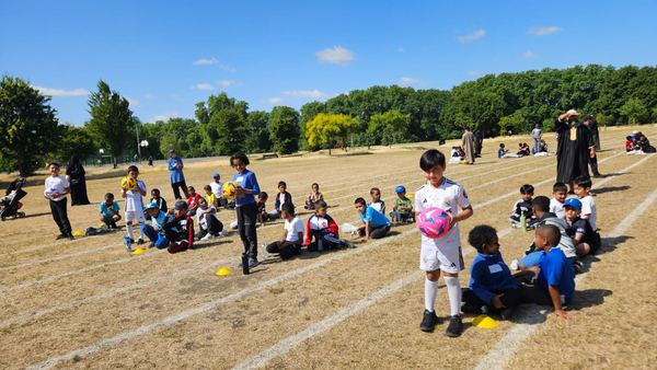 Pupils practising football skills at Sports Day