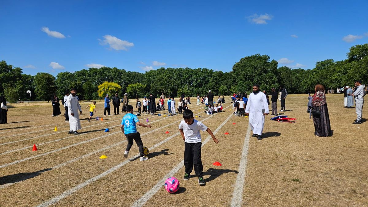 Pupils playing football at Sports Day